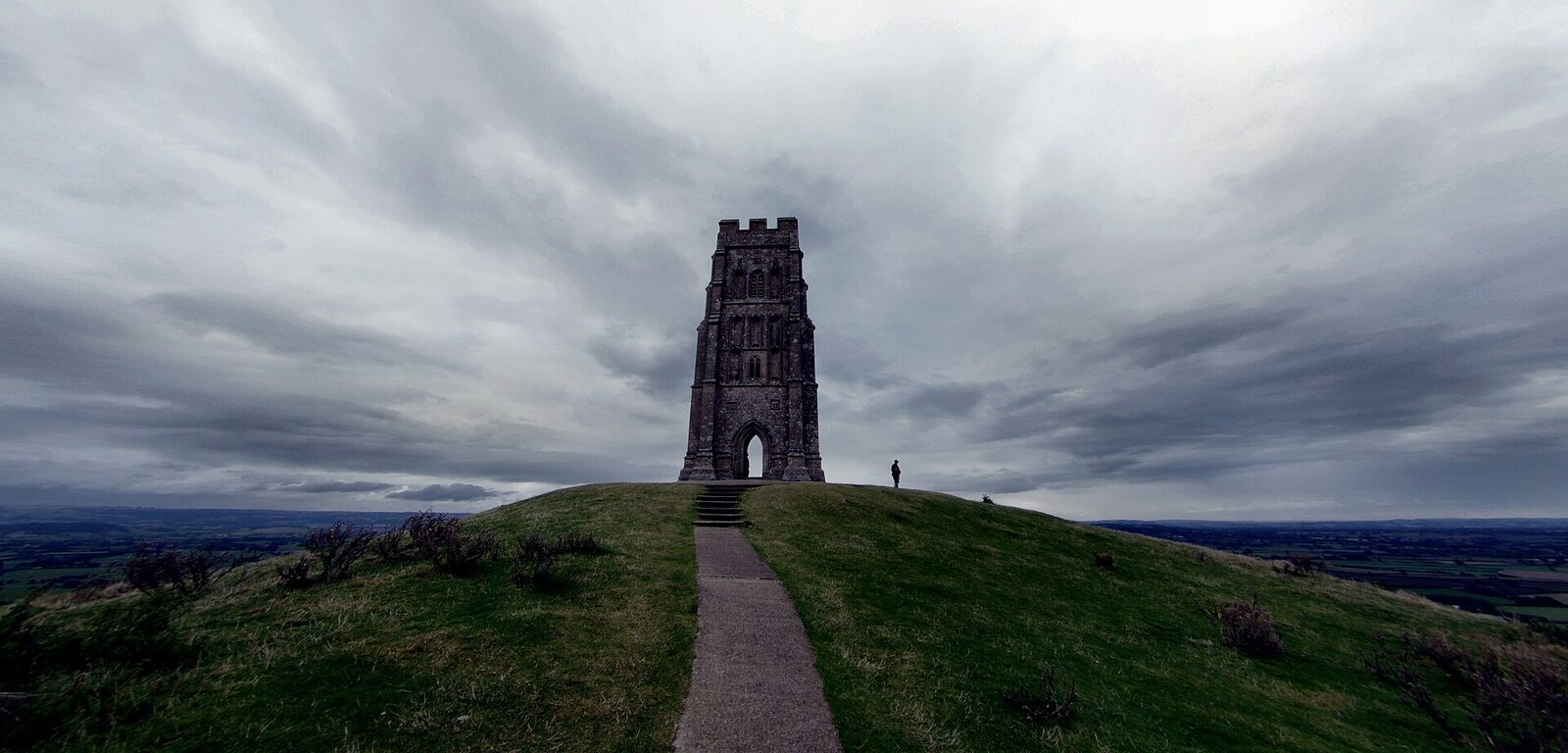Glastonbury Tor under a brooding sky, St Michael's tower on the summit